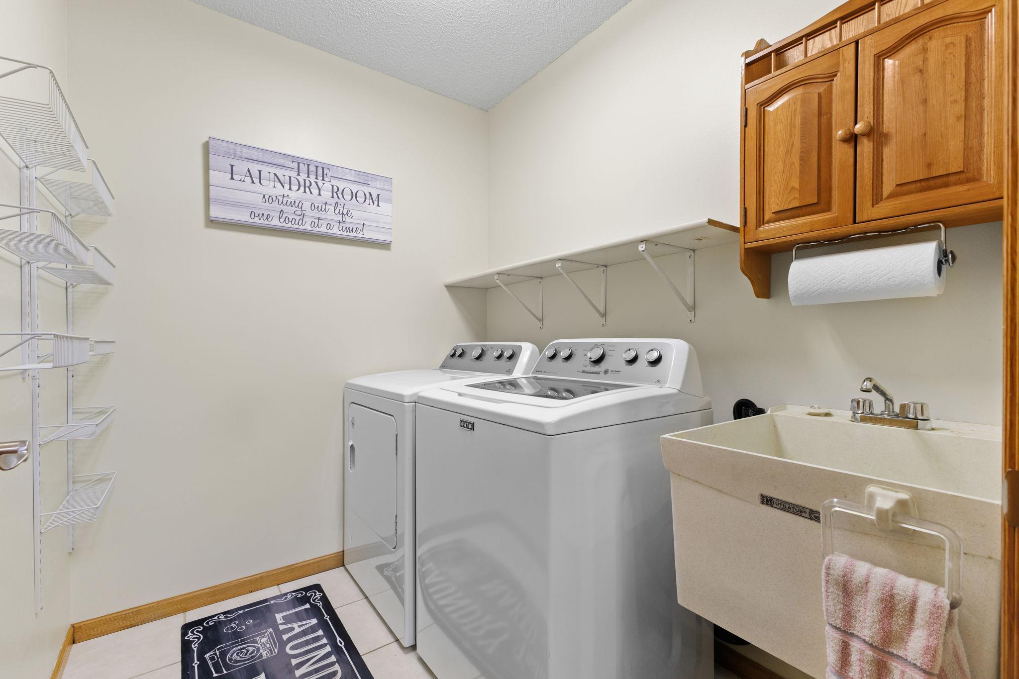 The washer and dryer are included in the sale. Convenient laundry sink, too!