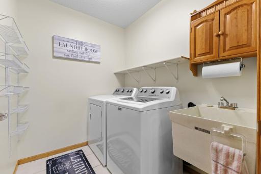 The washer and dryer are included in the sale. Convenient laundry sink, too!