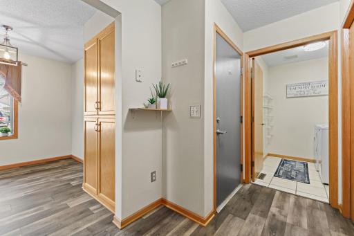 View to the entry from the garage, and dedicated laundry room. This townhome really feels like a home.