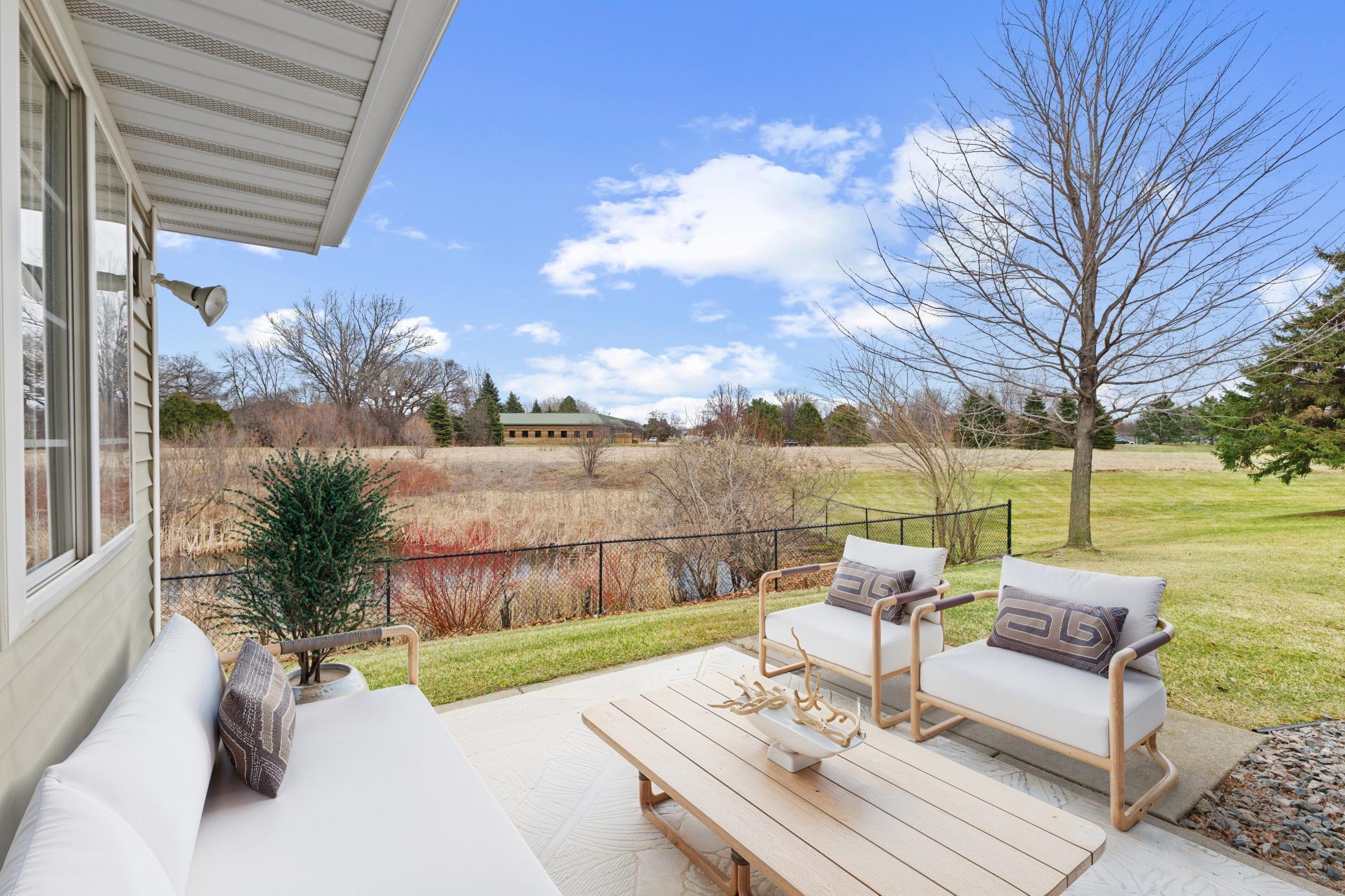 Rear Patio & View - please note this image has been virtually staged.