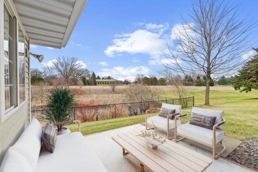 Rear Patio & View - please note this image has been virtually staged.