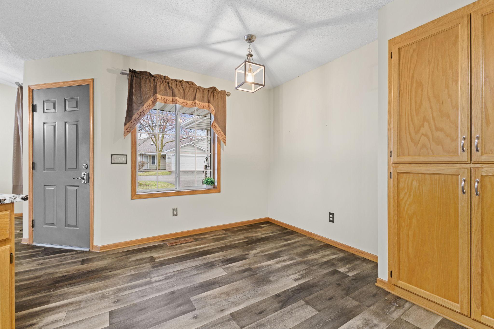 The eat-in kitchen features a pantry area, plus a great spot for a bistro table to enjoy your morning coffee.