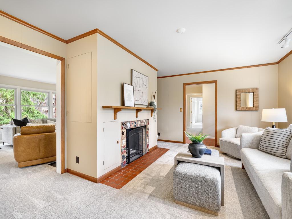 Open layout with a fireplace viewable from living and family spaces