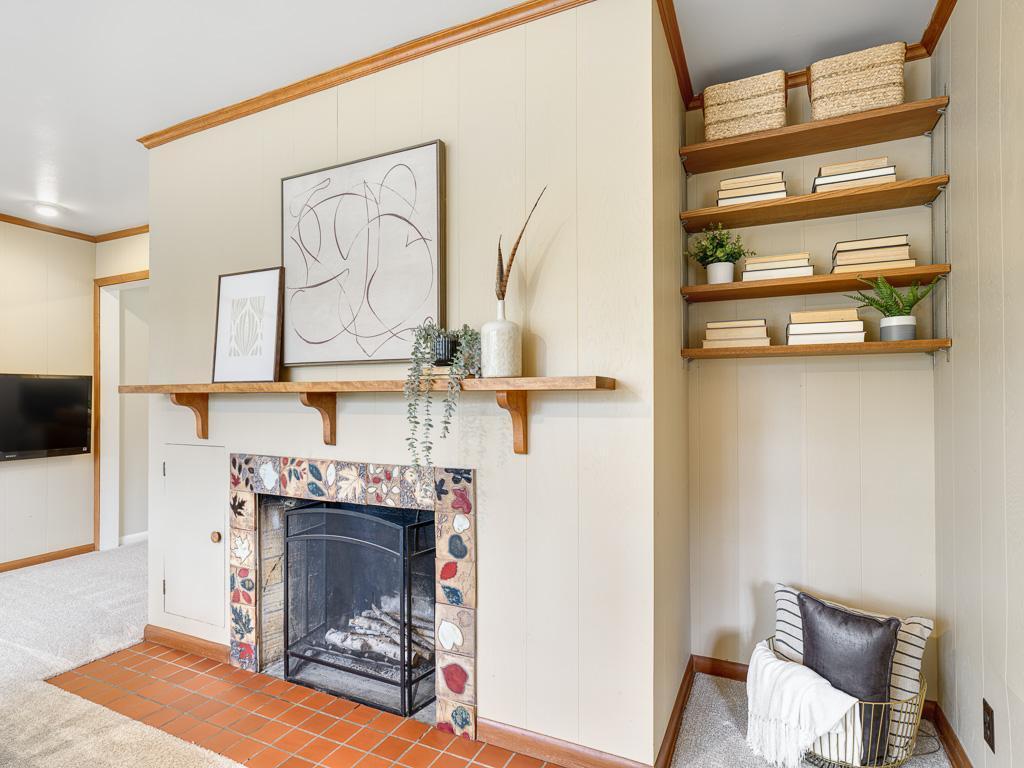 Family room wood-burning fireplace with shelving for your favorite books—charm and warmth combined