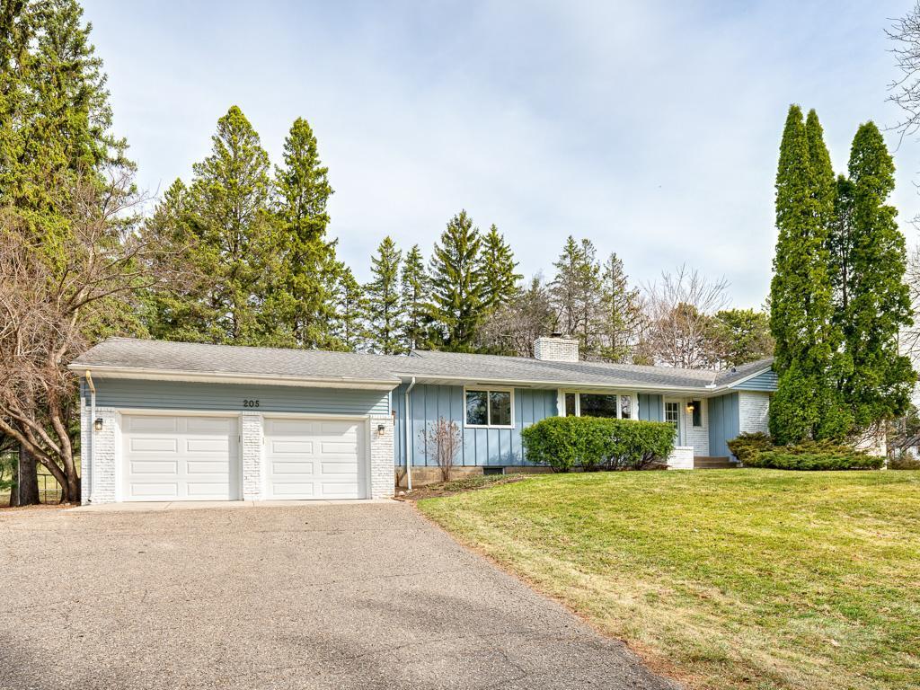 A charming 1958 rambler with three spacious bedrooms conveniently located on the main level