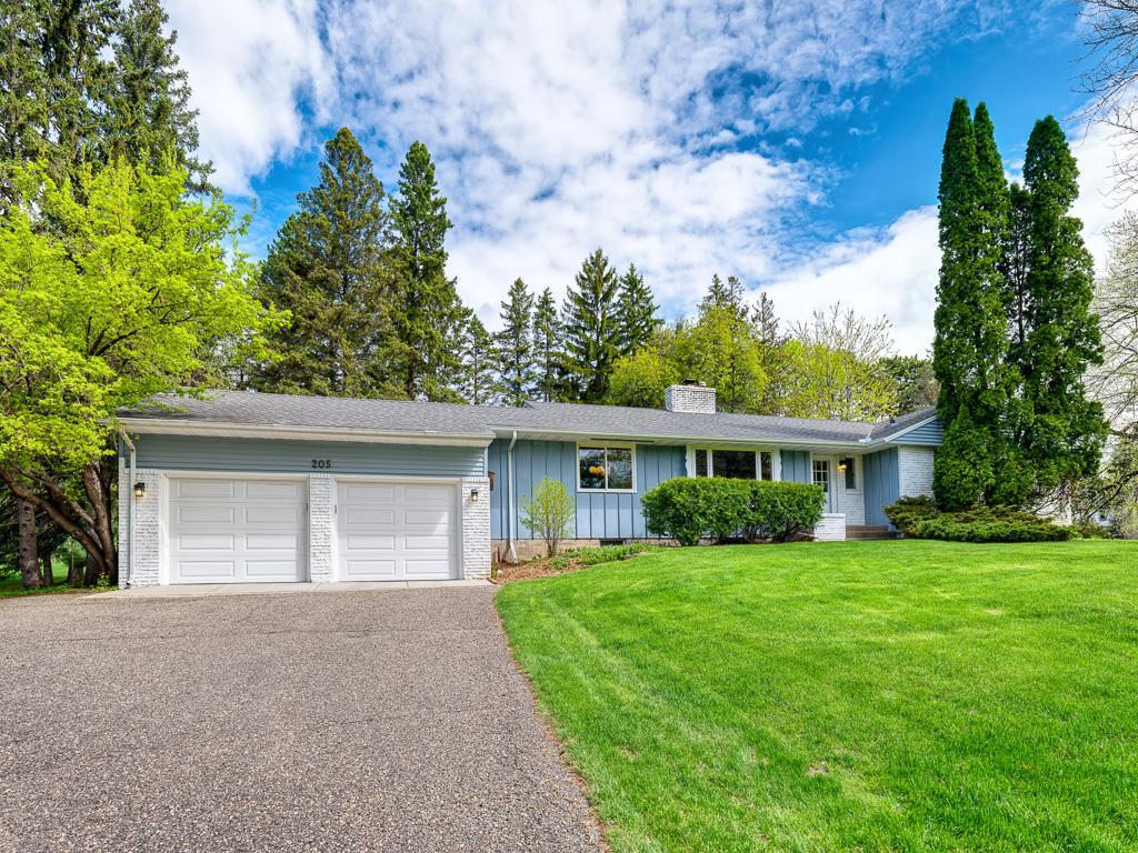 A charming 1958 rambler with three spacious bedrooms conveniently located on the main level