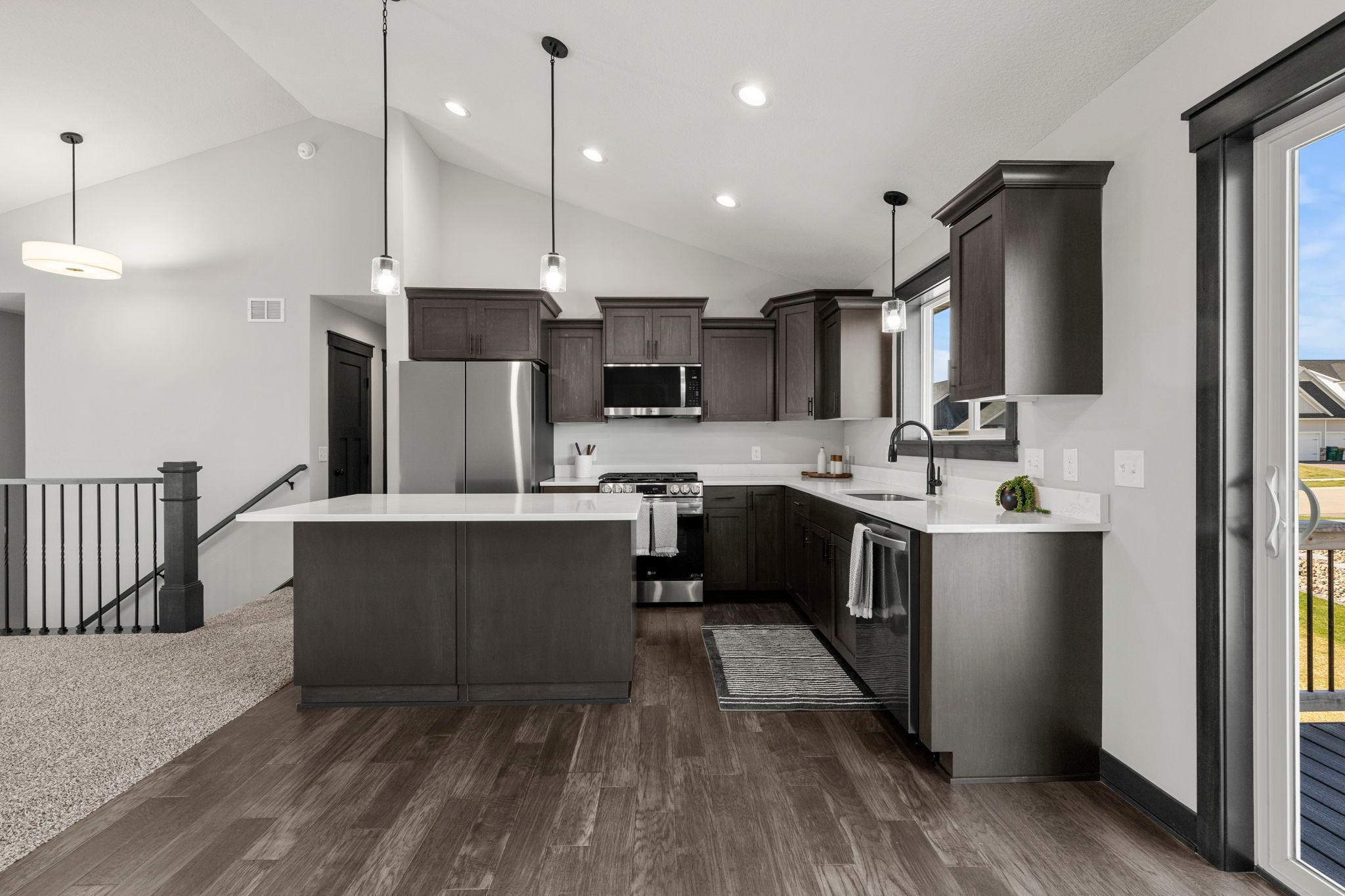 Craftsman-style kitchen blends timeless character with modern functionality. Gorgeous upgrades, entire home shows brand new!