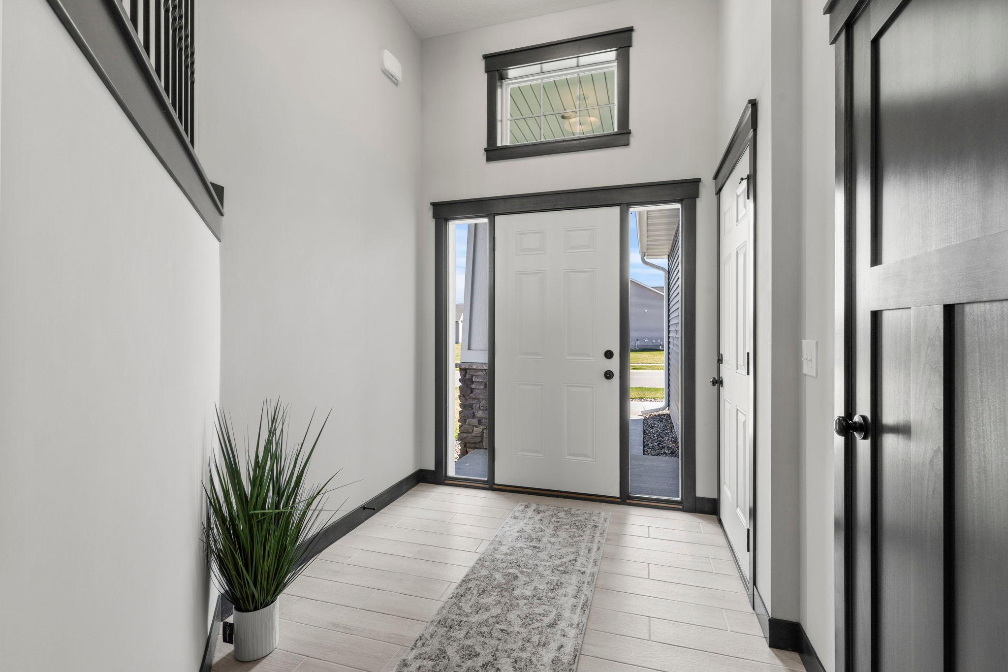 Welcome home! Just like new with upgraded tiled foyer! Towering and spacious foyer. Stylish Craftsman doors, trim and woodwork. Clean, neutral palette!