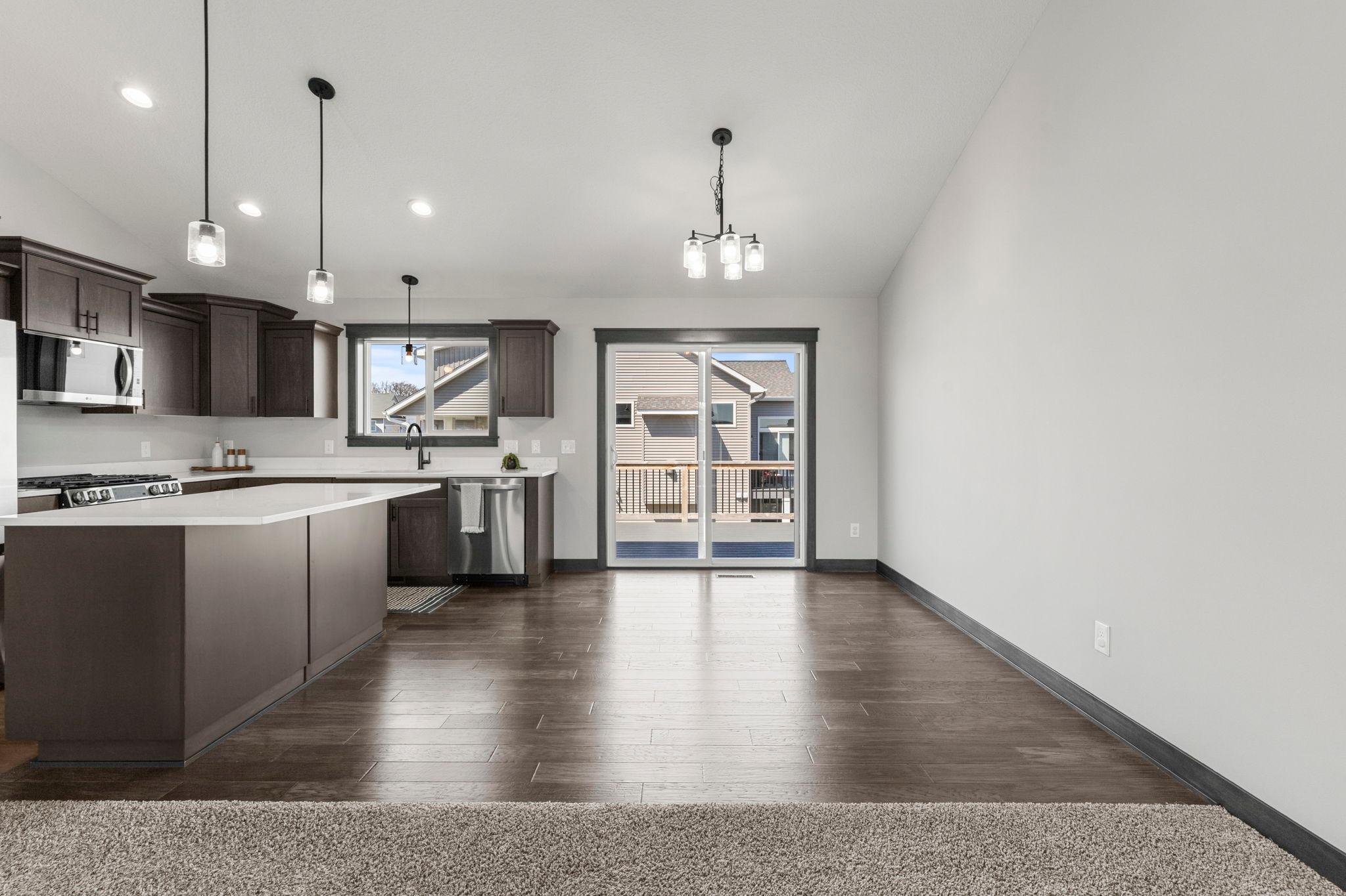 Beautiful LVP flooring spans the kitchen and dining. Walkout out to deck! Deck already finished and ready for you to enjoy Summer BBQ's overlooking backyard pond views. Spacious informal dining.