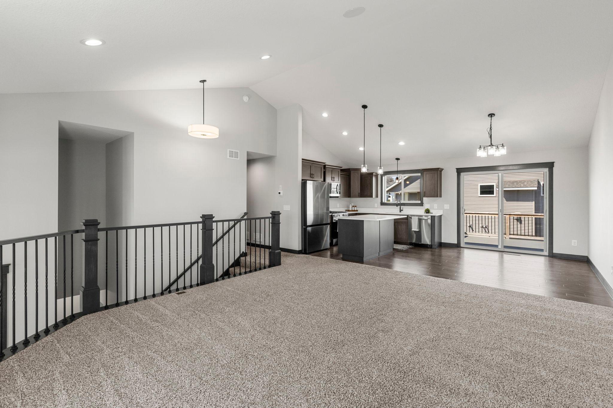 Open floor plan with vaulted ceilings. Warm, neutral colors throughout. Just like new with upgraded, main level lighting package.