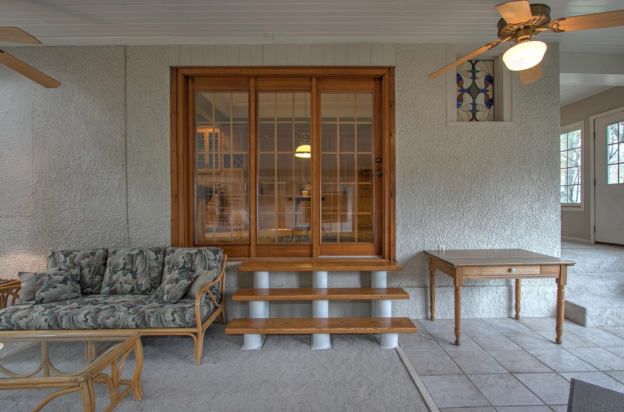 Sliding Patio Door lets in natural light into the informal dining area.
