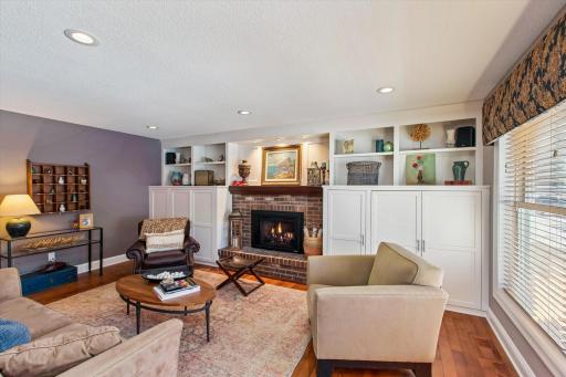 Main floor den with hardwood floors and newer gas fireplace