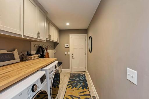 Main floor mud room with cubbies & laundry to garage off kitchen