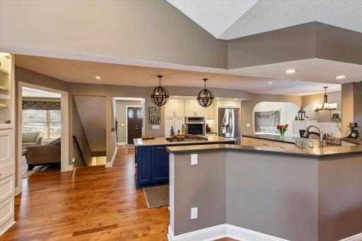 Formal dining space view to kitchen, lower level & front door