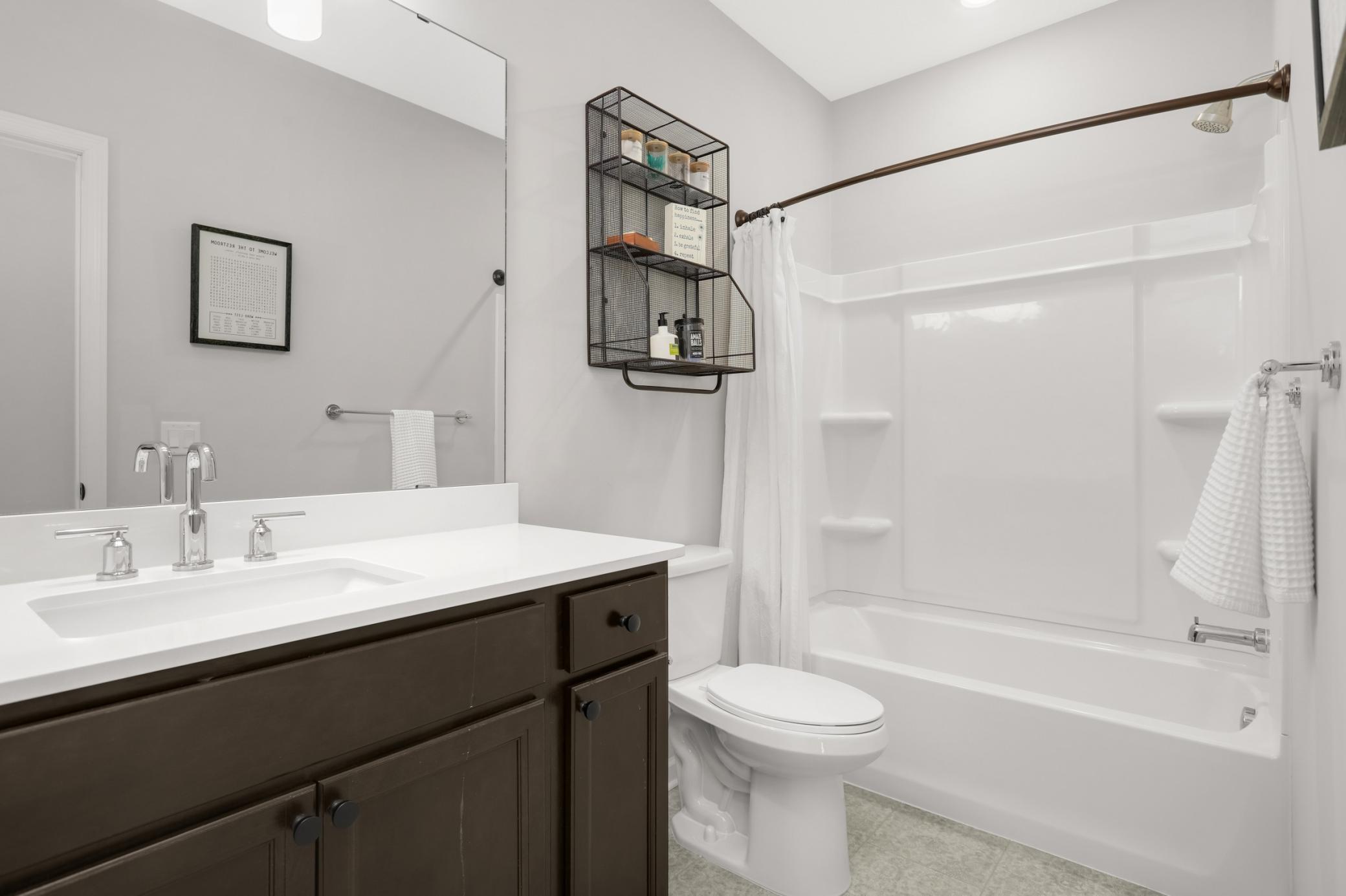 Full bath adjacent to the lower level bedroom.