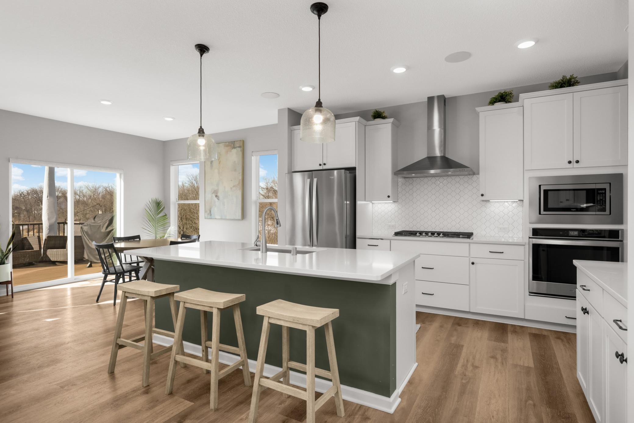 The center island is great for a quick bite or conversation. Another upgrade...the sellers installed a whole home water filtration system.