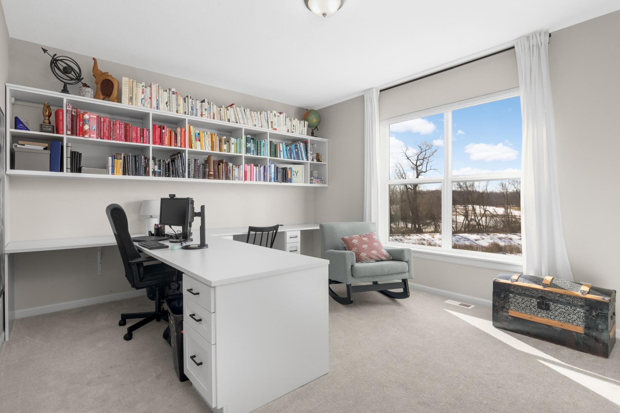 Currently being used as a second office, this main level bedroom is a fantastic option for multi generational living as there is a 3/4 bath adjacent.