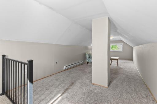 The loft space is accessed through the bedroom with the space mural. It is great additional space and has supplemental electric baseboard heat.