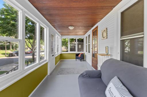 Super cute and large front porch with all new windows and trim. The trim work was finished after the photos were taken.