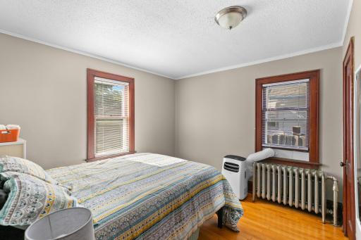 Bedroom #1 is located at the back of the home and also has great character with hardwood floors, original trim work and doors.