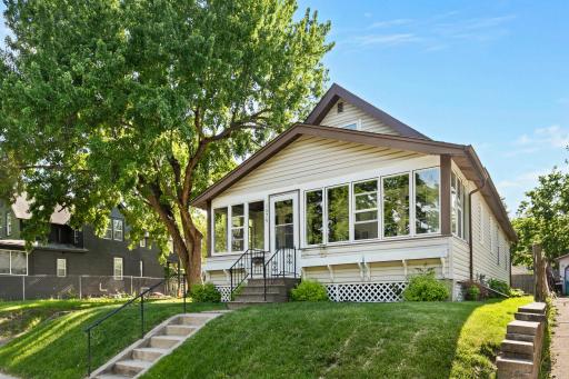 Check out this charming bungalow with an inviting front porch with all new windows and trim!