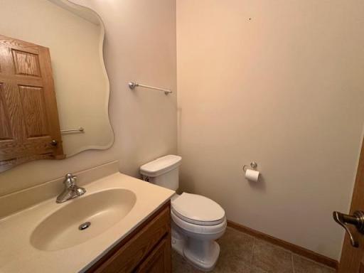 Convenient 1/2 bath in the hallway between living room and primary suite