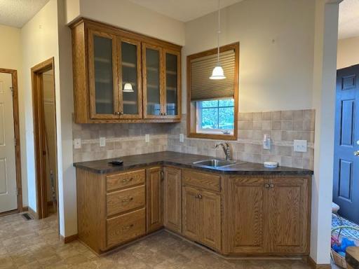 A great space with added cabinets and vegetable sink in the kitchen