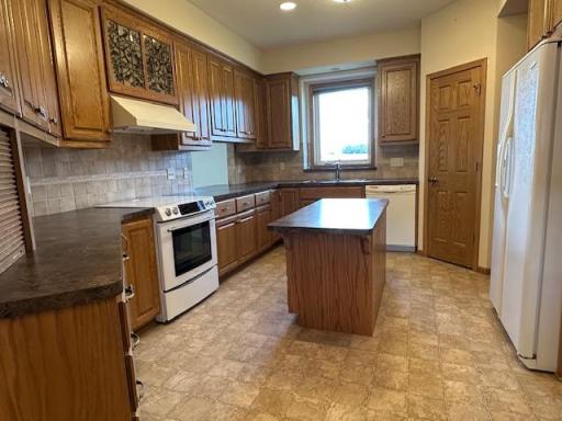 Well appointed kitchen with upgraded cabinets and center island.