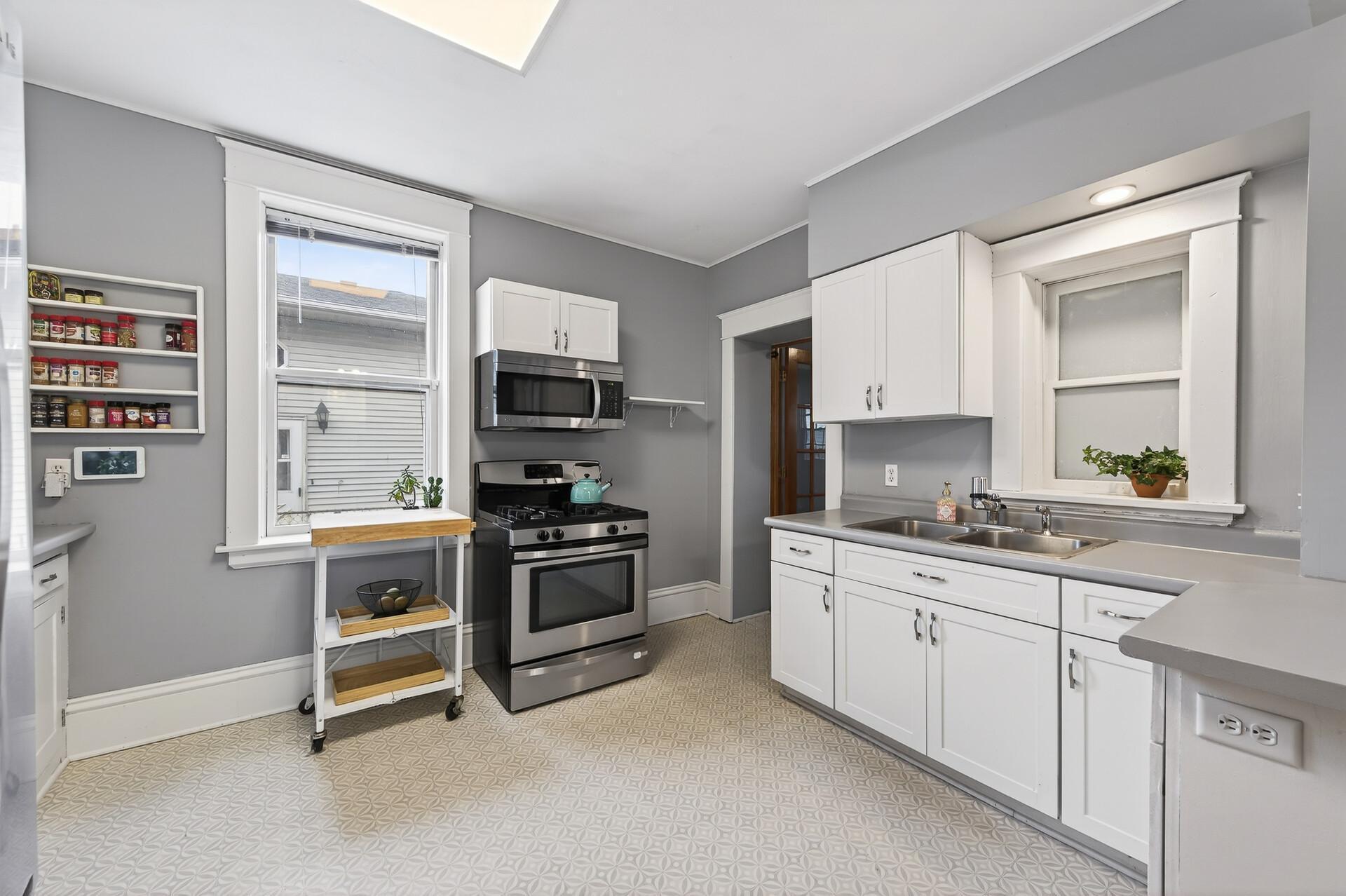 The kitchen is spacious with enough room to add an island if you choose.