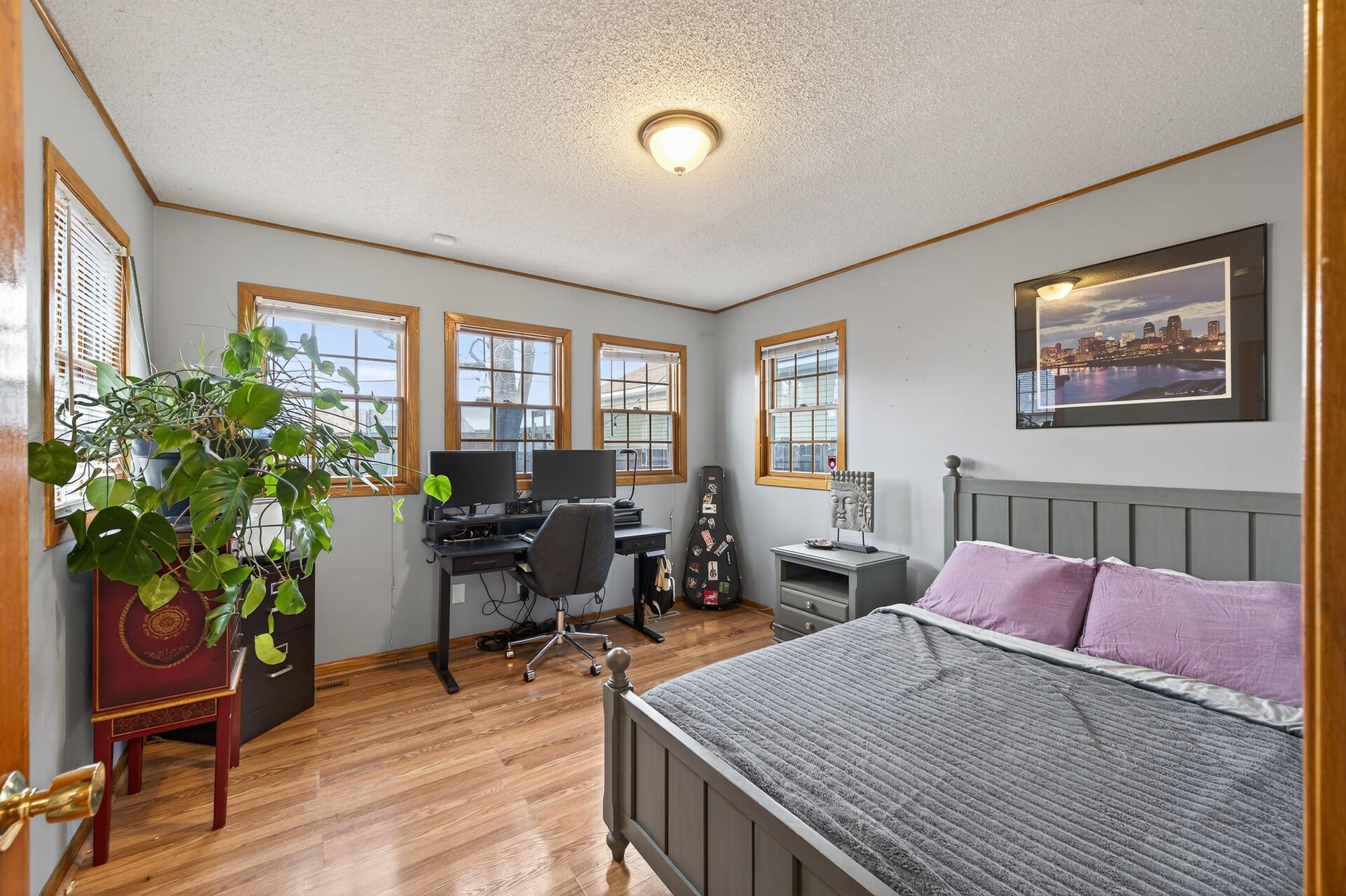 The main level bedroom or office is off the kitchen and gets loads of natural light.