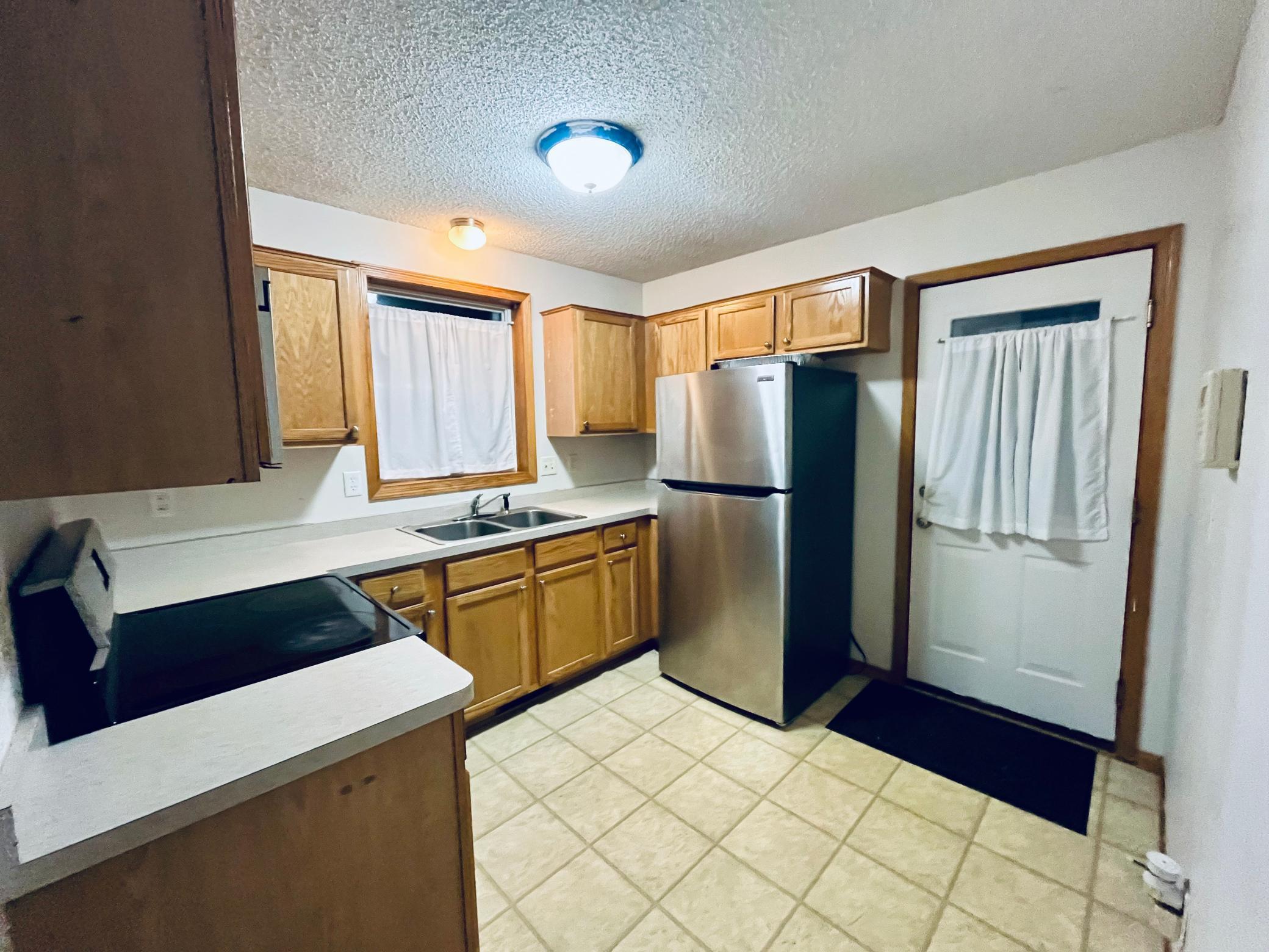 Kitchen with door access to back porch