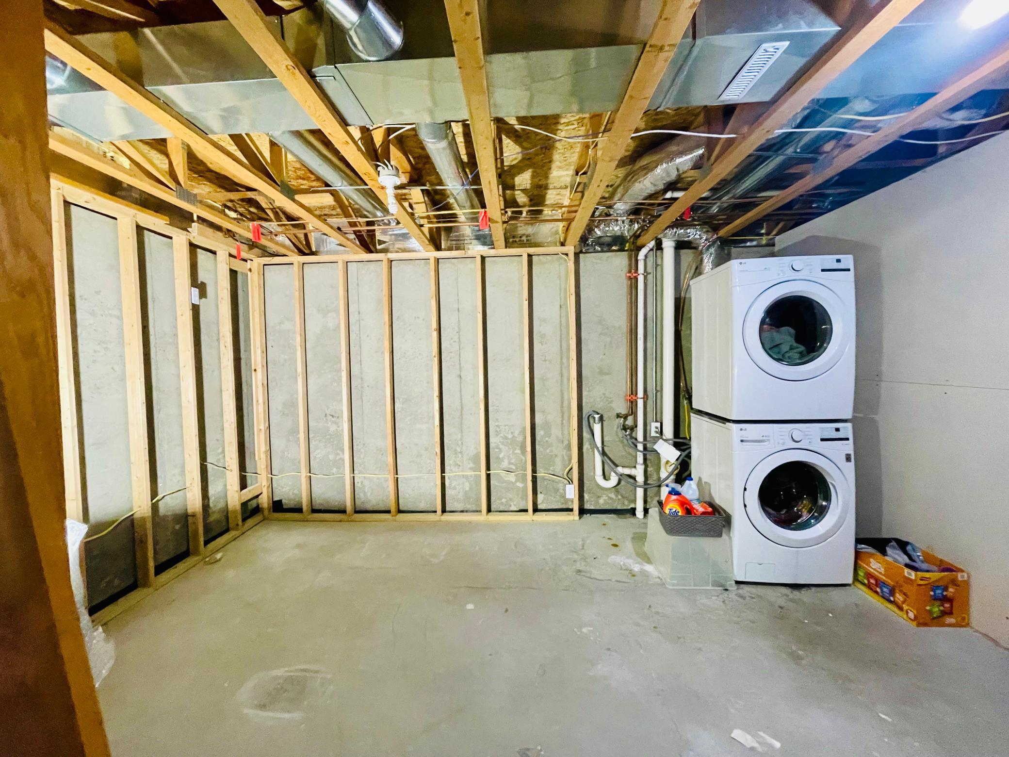 Laundry area in unfinished lower level