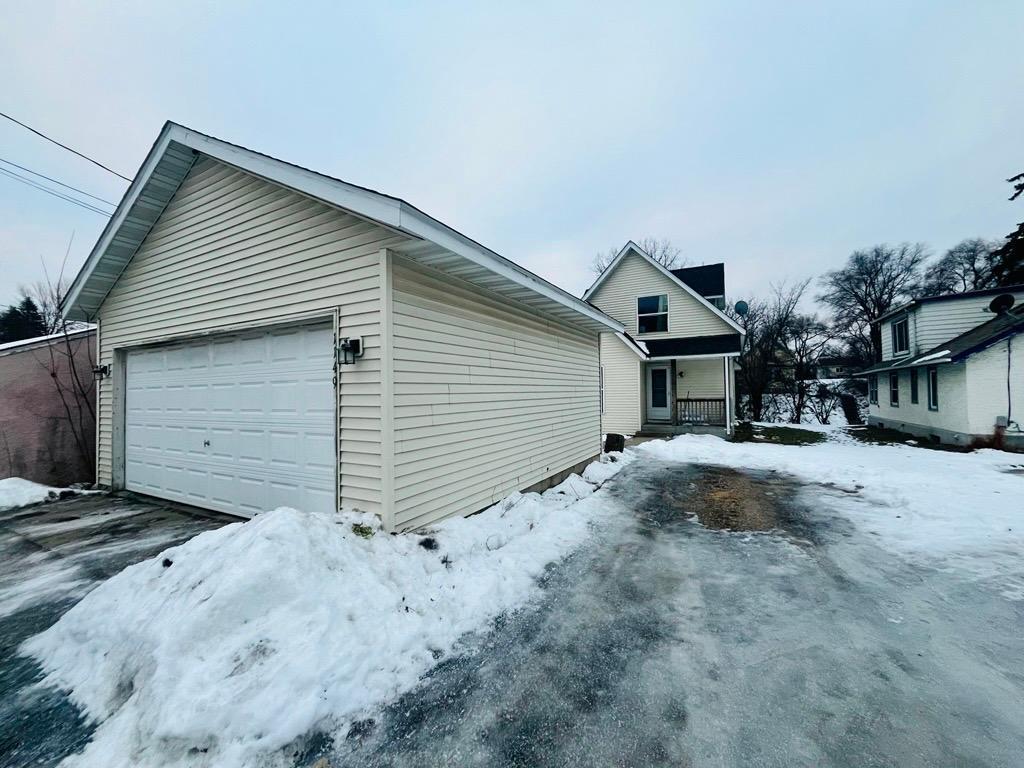 Large detached two car garage with extra parking spot