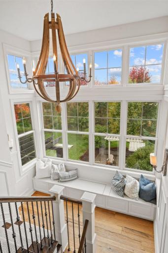 Jaw-dropping stairwell with custom storage bench.