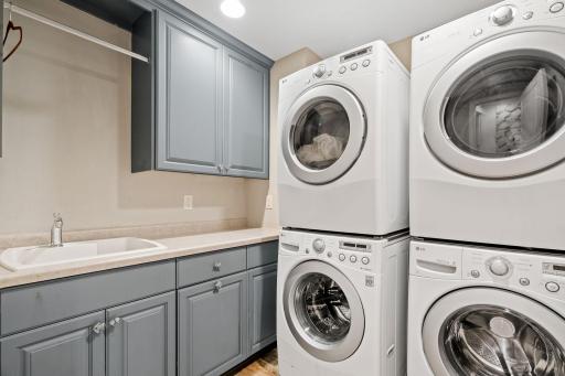 Upper level laundry with 2 washers and 2 dryers.