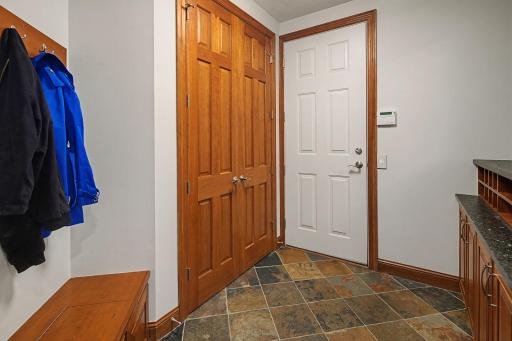 Mudroom Entry with Drop zone with storage, Bench with storage and Closet