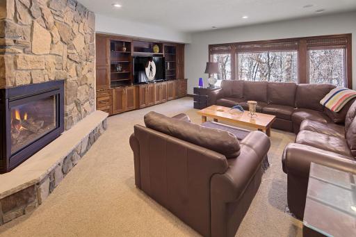 Family Room with two-sided Fireplace Lower Level
