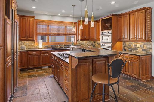 Kitchen working side of Island. Gas cooktop with downdraft