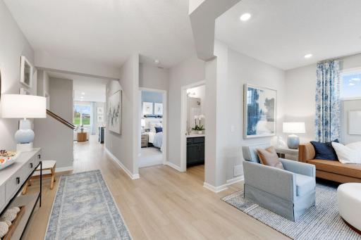 The entry feels bright and open, with a flex space, full bath and bedroom at the front of the home. This bedroom and bath are nicely separated from the owner's suite at the back of the home.