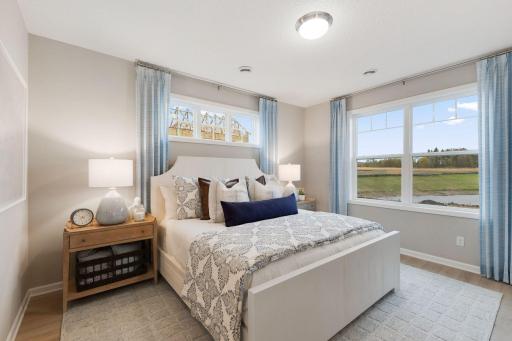 The primary bedroom is very spacious to accommodate all of your bedroom furniture.
