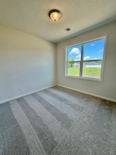 Actual home's second bedroom, located directly next to the second bath.