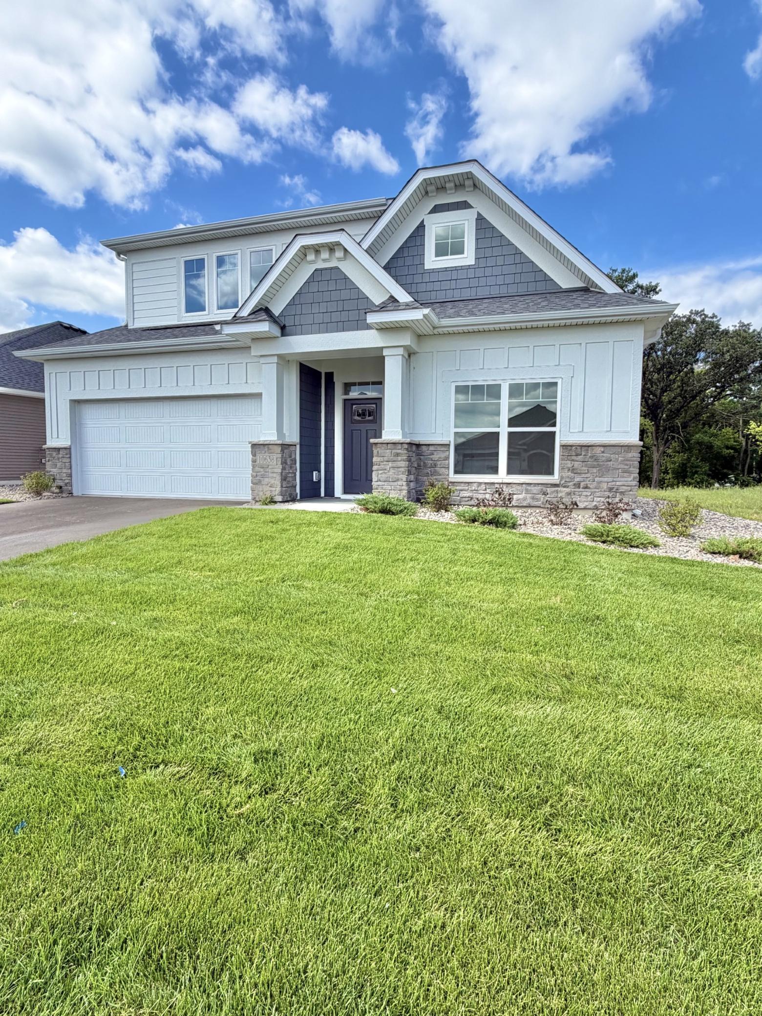 Photo of actual home - irrigation, sod, and landscaping are all included.