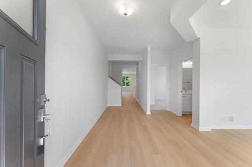 Actual home foyer, looking to secondary bedroom and bathroom