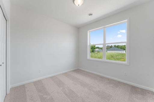Secondary bedroom at the front of the home is perfect for guests!