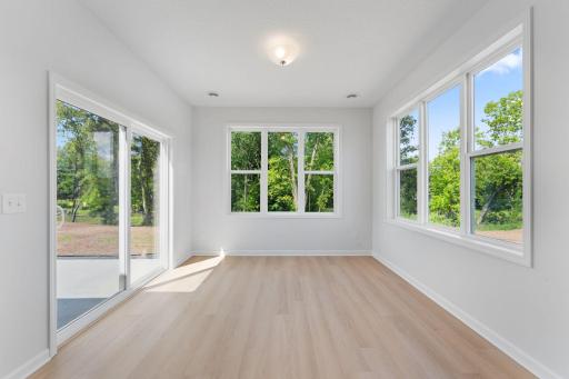 The morning room, with view of the trees, is the perfect place to cozy up with a book or cup of coffee!