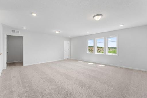 HUGE upper level loft is perfect as another living area, movie room, or exercise, craft or play space! Half bath and finished storage room complete the upper level.