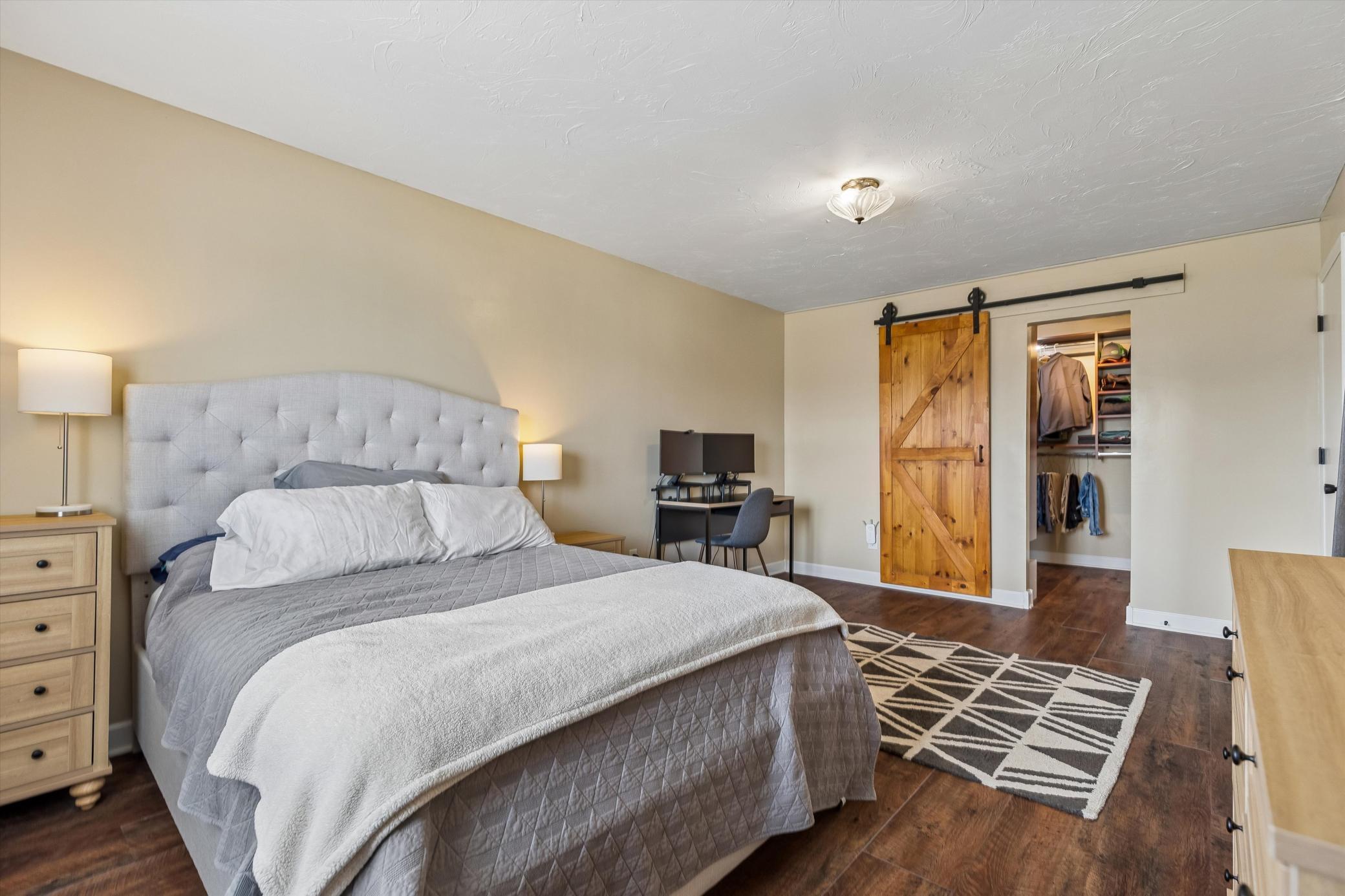Stunning barn doors leading to the massive closet