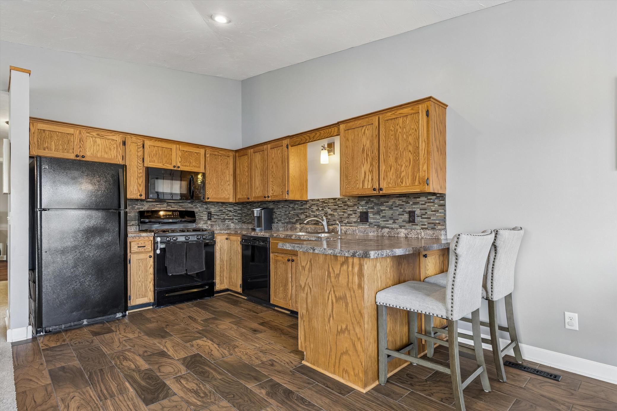 Bright and functional kitchen featuring ample cabinetry, generous counter space, and a layout designed for both everyday living and entertaining.