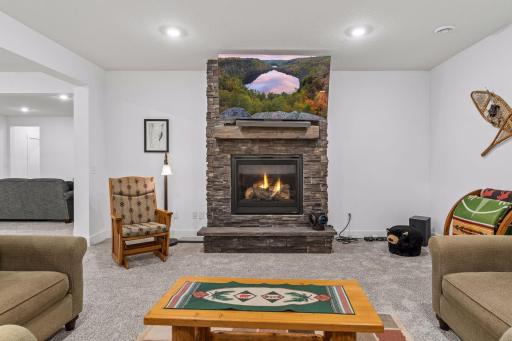 Lower level family room with gas fireplace.