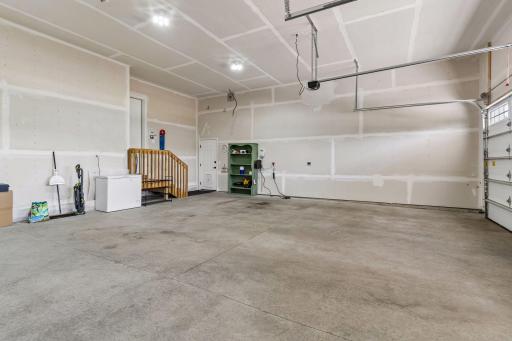 The insulated garage has room for vertical storage or a pulley system for canoes in the garage.